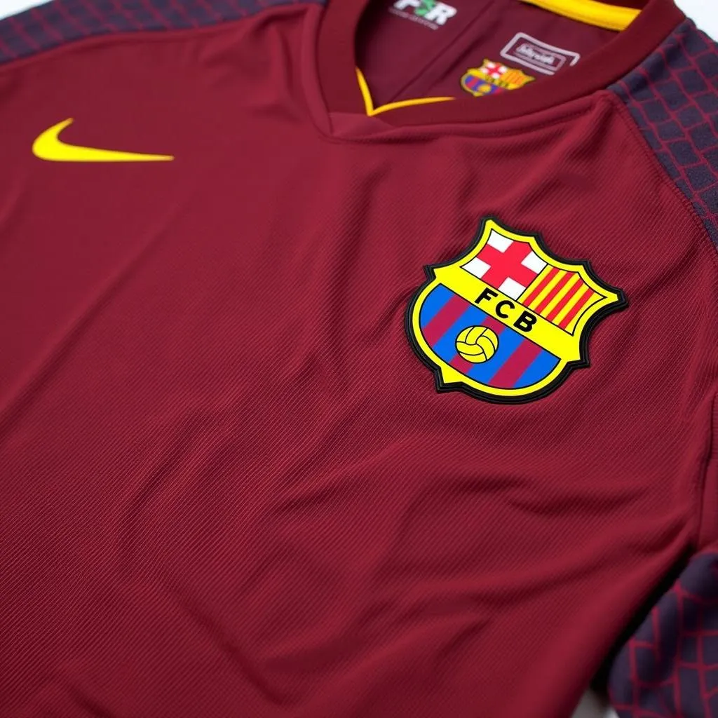 A close-up view of the FC Barcelona 2016-17 training kit, showcasing its stylish design and the club's signature blue and garnet colors.